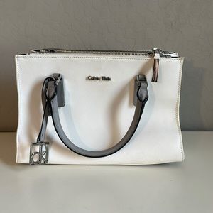Calvin Klein purse with multiple pockets. Detachable cross body strap